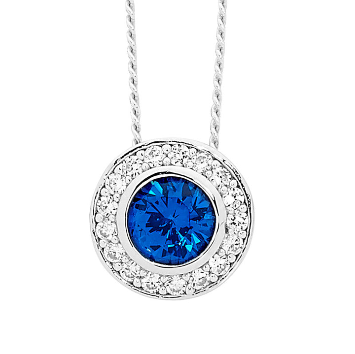 SS Round Dark Blue CZ Sol. w/ WH CZ Claw Surround Pendant