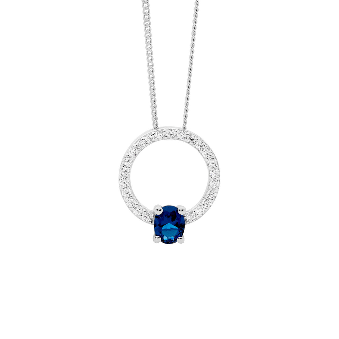 SS WH CZ 13mm open circle pendant w/london blue cz oval